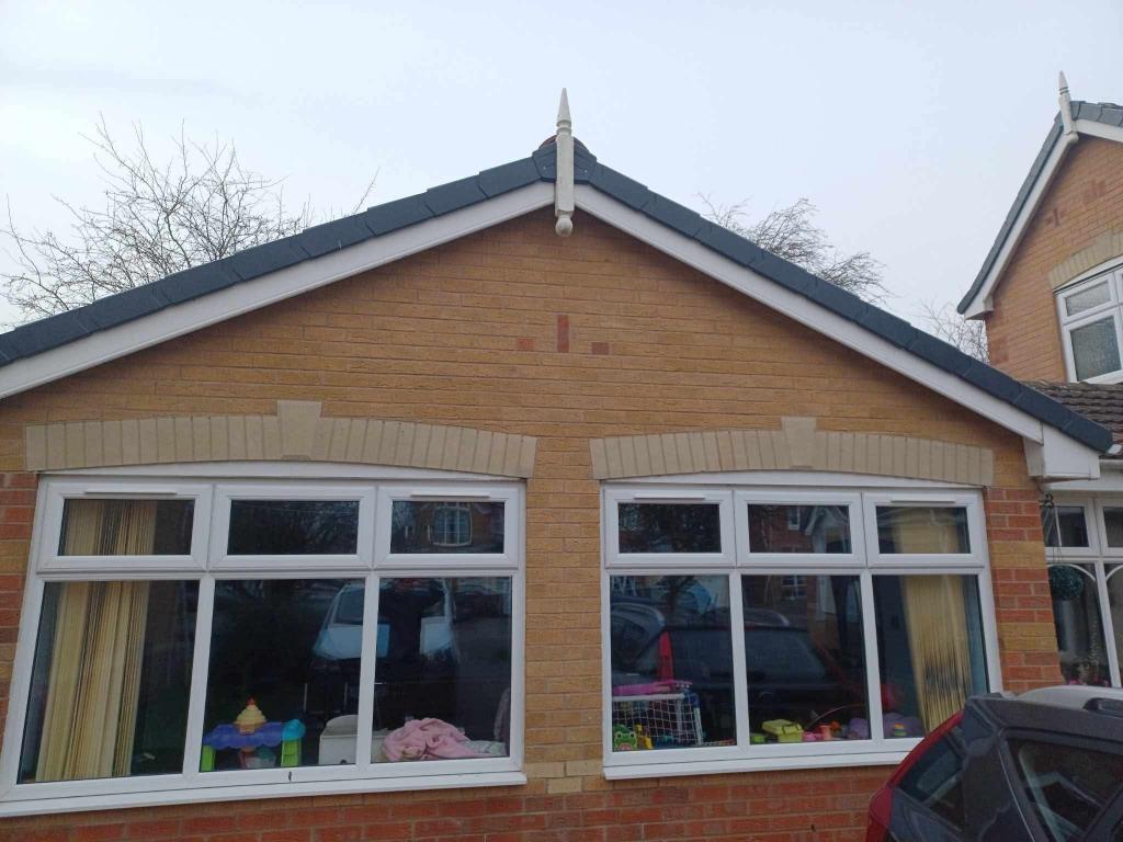 Finished gable roof with dark grey trims