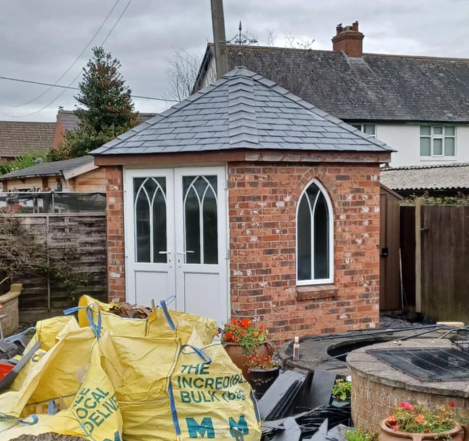 Bespoke garden summerhouse with new natural slate hip roof