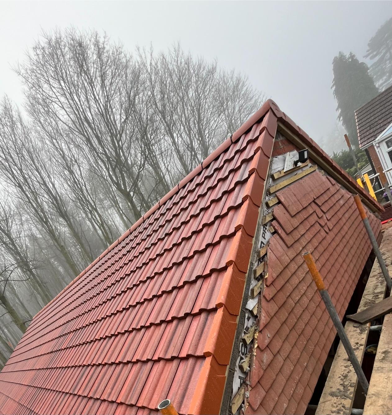 Hip roof with new clay tiles